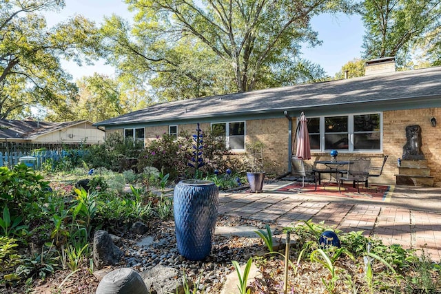 back of property featuring a patio area