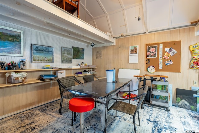 dining room featuring vaulted ceiling