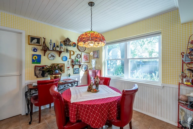 dining room with tile patterned flooring and a healthy amount of sunlight