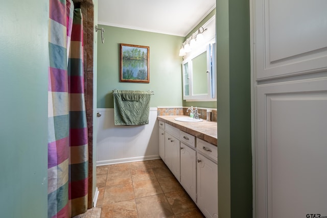 bathroom with vanity and crown molding