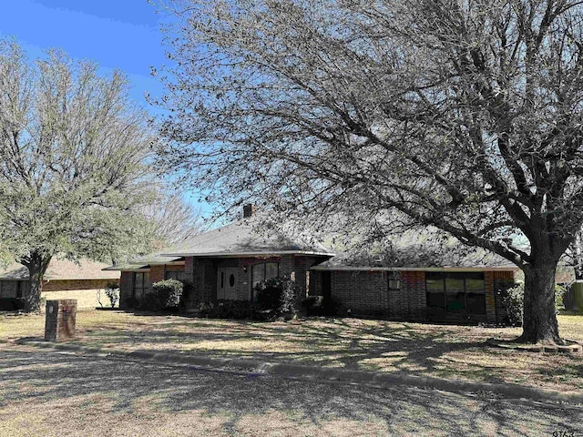 view of front of property featuring brick siding