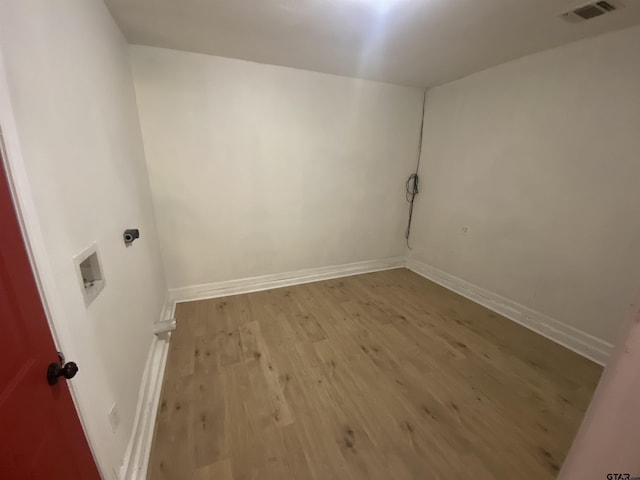 3903 Appletree Ln, Tyler, TX 75701 - laundry area featuring electric dryer hookup and wood finished floors