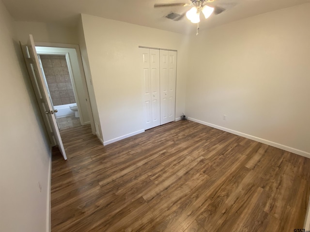 3903 Appletree Ln, Tyler, TX 75701 - unfurnished bedroom featuring dark wood-style floors, a closet, and a ceiling fan