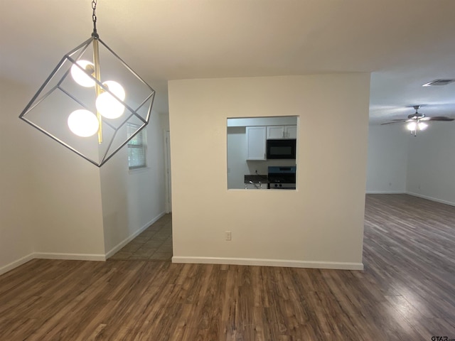 3903 Appletree Ln, Tyler, TX 75701 - empty room with wood finished floors, ceiling fan, and a chandelier