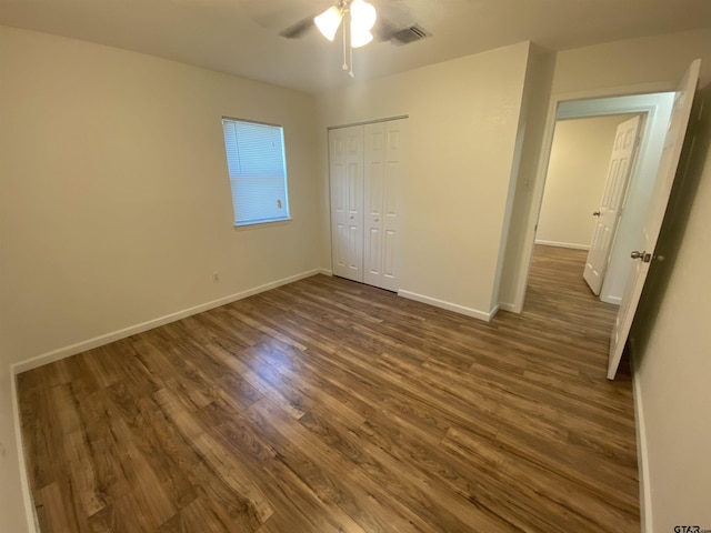 3903 Appletree Ln, Tyler, TX 75701 - unfurnished bedroom with dark wood finished floors, a closet, and a ceiling fan