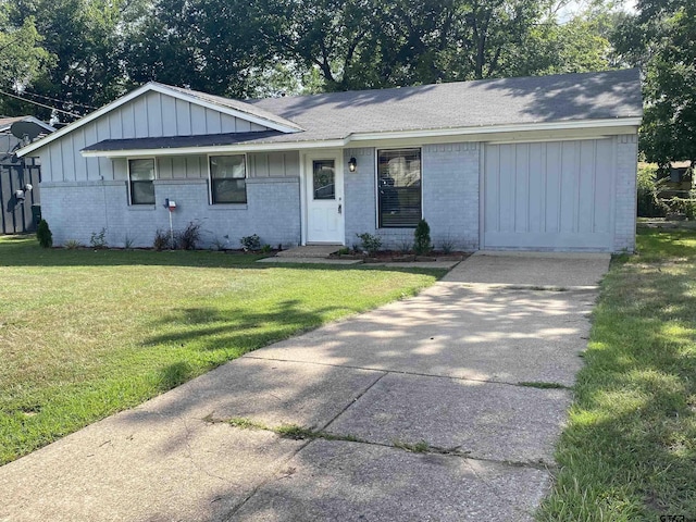 3903 Appletree Ln, Tyler, TX 75701 - ranch-style home featuring brick siding, a front lawn, board and batten siding, and a shingled roof