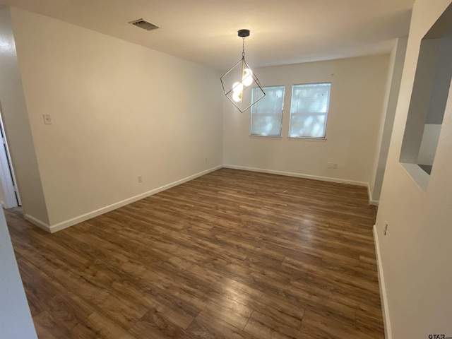 3903 Appletree Ln, Tyler, TX 75701 - unfurnished dining area featuring dark wood-style flooring and baseboards