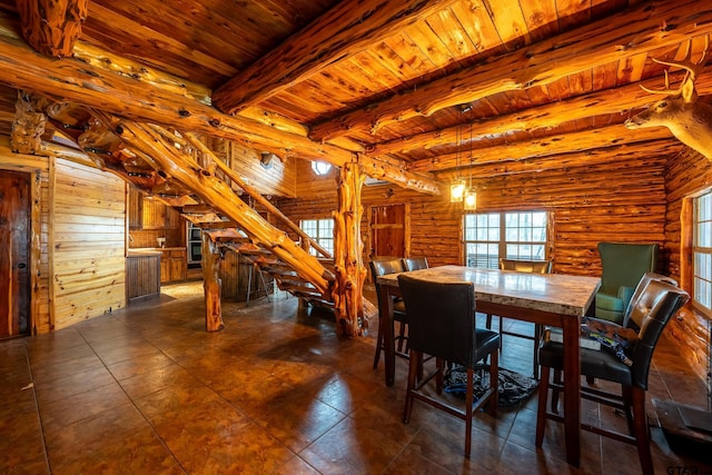 dining space featuring wood ceiling, beam ceiling, log walls, and a wealth of natural light