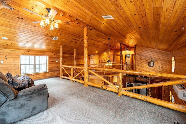 sitting room featuring lofted ceiling, wood ceiling, ceiling fan, wooden walls, and carpet