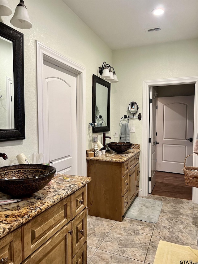 bathroom featuring hardwood / wood-style floors and vanity