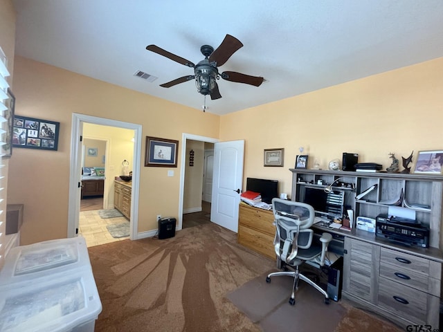 home office with carpet and ceiling fan