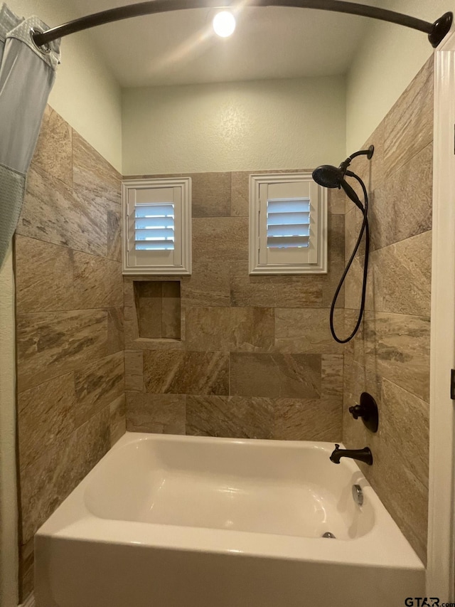 bathroom featuring shower / tub combo with curtain