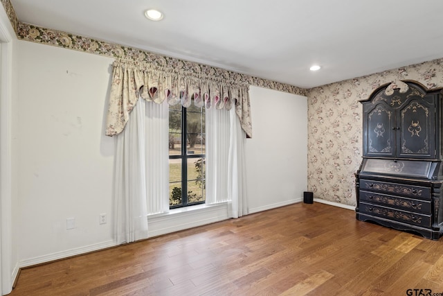205 Turnberry Cir, Mount Pleasant, TX 75455 - unfurnished room with wood finished floors, baseboards, recessed lighting, and wallpapered walls