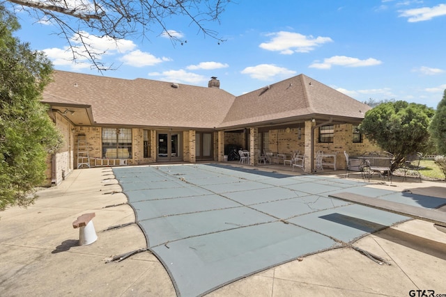 205 Turnberry Cir, Mount Pleasant, TX 75455 - view of pool with a patio, a covered pool, and a diving board