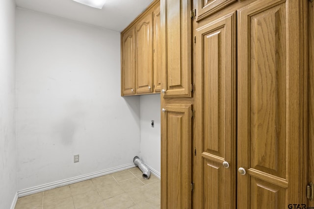 205 Turnberry Cir, Mount Pleasant, TX 75455 - washroom with cabinet space, hookup for an electric dryer, baseboards, and light tile patterned flooring