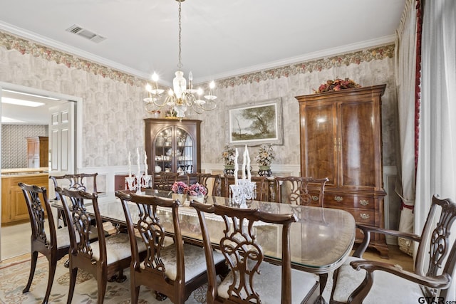 205 Turnberry Cir, Mount Pleasant, TX 75455 - dining space featuring wallpapered walls, a chandelier, wainscoting, and crown molding