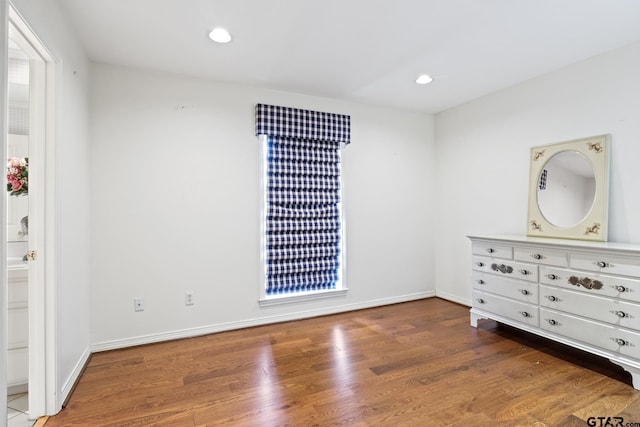 205 Turnberry Cir, Mount Pleasant, TX 75455 - unfurnished bedroom with wood finished floors, recessed lighting, and baseboards