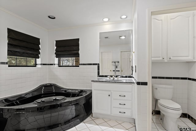 205 Turnberry Cir, Mount Pleasant, TX 75455 - full bath with tile walls, tile patterned floors, crown molding, toilet, and a garden tub