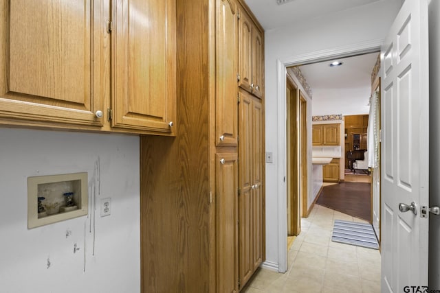 205 Turnberry Cir, Mount Pleasant, TX 75455 - washroom with washer hookup, light tile patterned floors, and cabinet space