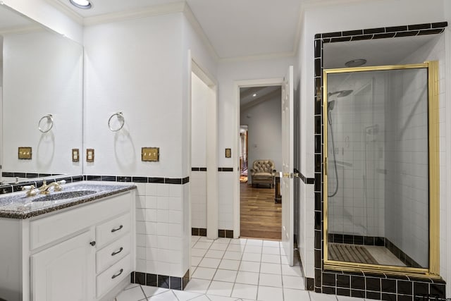 205 Turnberry Cir, Mount Pleasant, TX 75455 - full bath featuring a shower stall, crown molding, vanity, tile walls, and tile patterned flooring