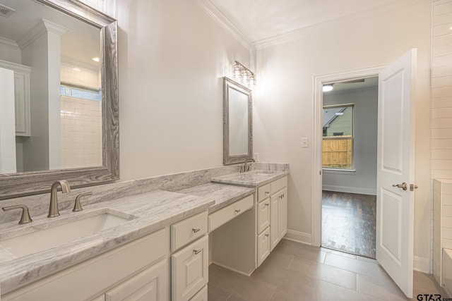 bathroom with hardwood / wood-style floors, vanity, shower / tub combination, and crown molding