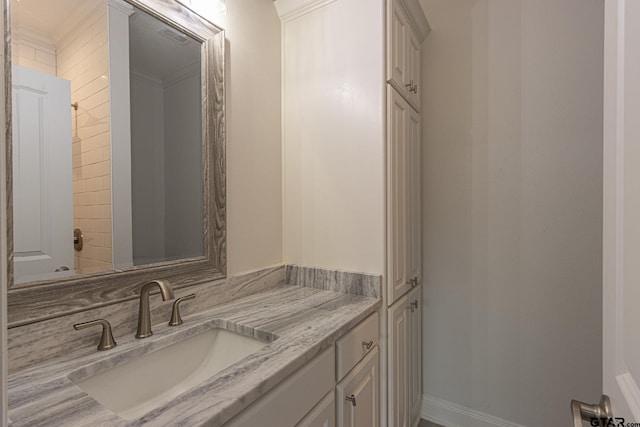 bathroom featuring vanity and crown molding