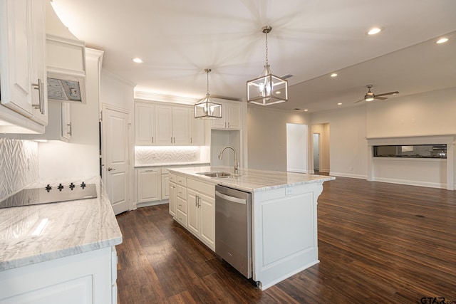 kitchen featuring a center island with sink, sink, dark hardwood / wood-style floors, white cabinets, and dishwasher