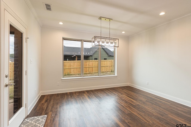 unfurnished dining area featuring dark hardwood / wood-style flooring and crown molding