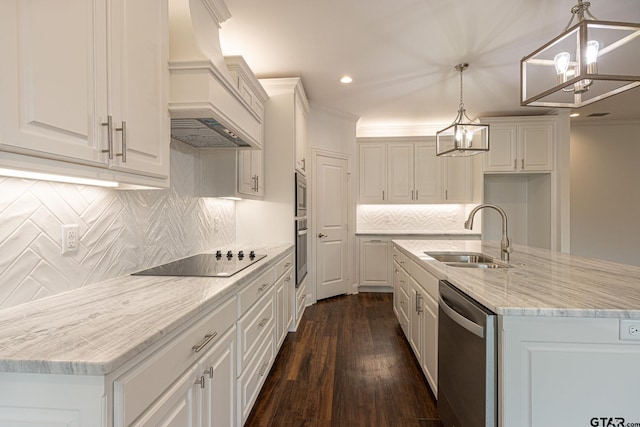 kitchen featuring white cabinetry, hanging light fixtures, custom range hood, and stainless steel appliances