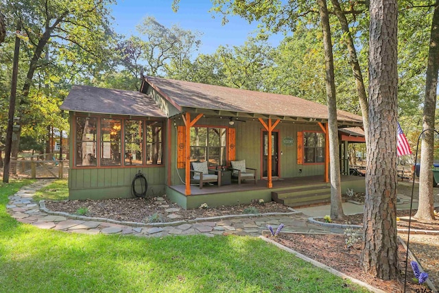 view of front facade with a sunroom