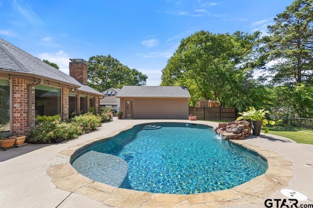 view of swimming pool featuring fence, a patio area, and a fenced in pool