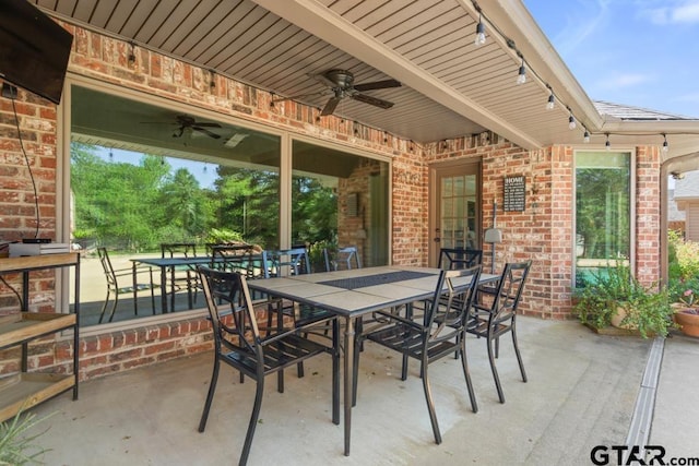 view of patio / terrace featuring outdoor dining area and a ceiling fan