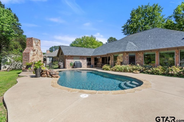 pool featuring a patio area