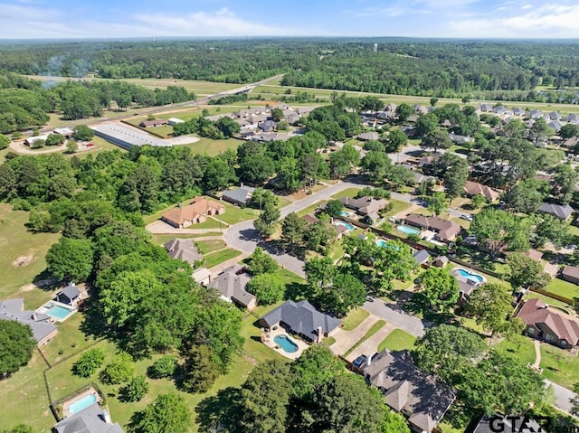 bird's eye view with a residential view and a wooded view