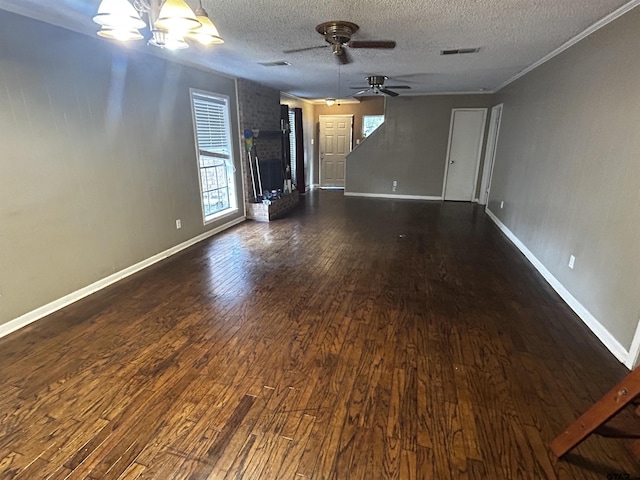 unfurnished living room featuring a textured ceiling, dark hardwood / wood-style flooring, and ceiling fan with notable chandelier