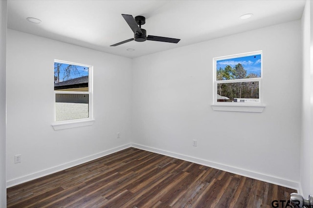 empty room featuring recessed lighting, baseboards, dark wood-type flooring, and a ceiling fan