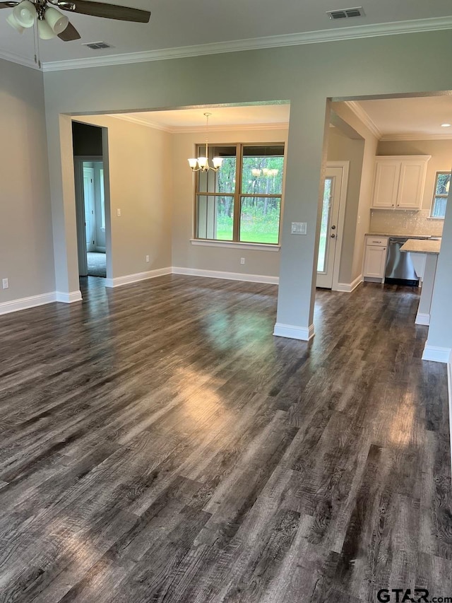 unfurnished living room featuring ceiling fan with notable chandelier, dark hardwood / wood-style flooring, and ornamental molding