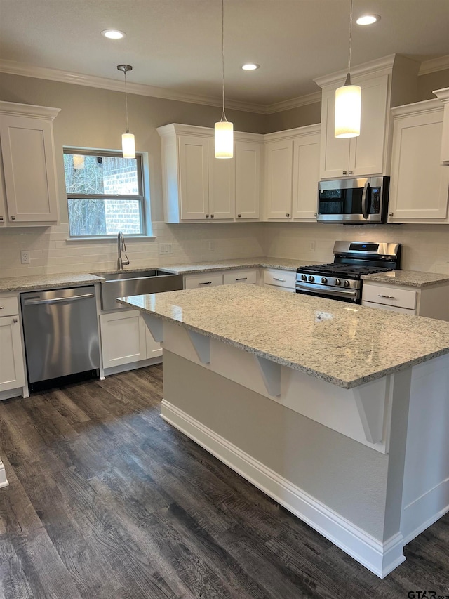 kitchen with stainless steel appliances, dark hardwood / wood-style floors, white cabinetry, and sink