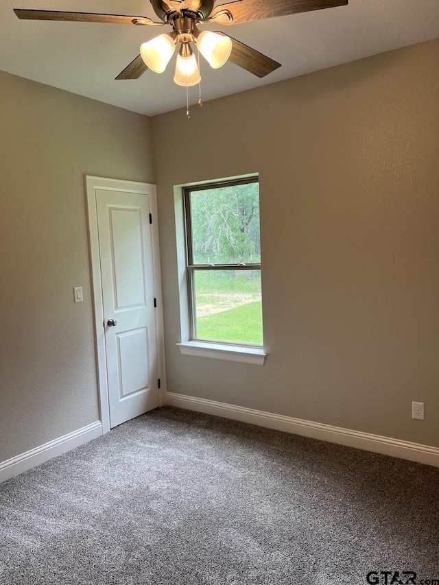 carpeted empty room with ceiling fan