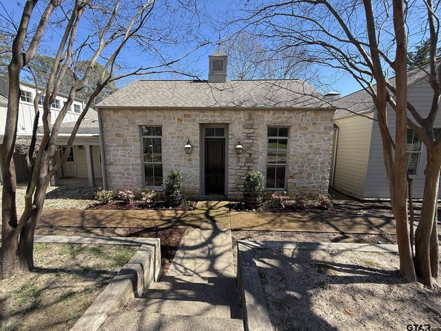 23611 Ridgeview Dr, Bullard, TX 75757 - view of front of house with stone siding, a chimney, and a shingled roof
