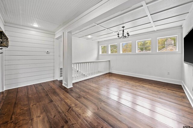 23611 Ridgeview Dr, Bullard, TX 75757 - unfurnished room featuring hardwood / wood-style floors, a chandelier, and wooden walls