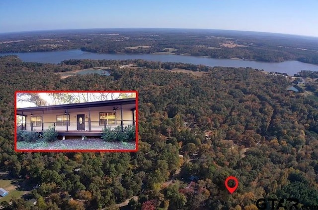 birds eye view of property featuring a water view