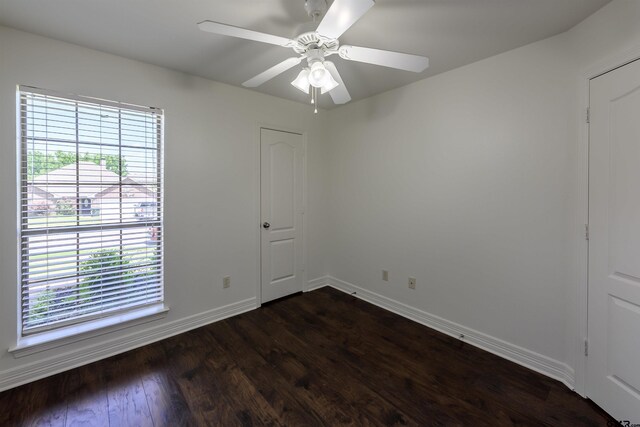 2056 Balsam Gap, Tyler, TX 75703 - spare room featuring dark wood-type flooring, a healthy amount of sunlight, baseboards, and ceiling fan