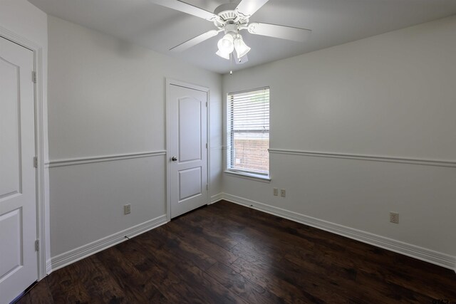 2056 Balsam Gap, Tyler, TX 75703 - spare room featuring dark wood finished floors, baseboards, and a ceiling fan
