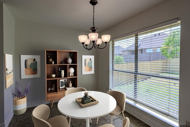2056 Balsam Gap, Tyler, TX 75703 - dining area with tile patterned flooring and a chandelier