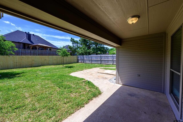 2056 Balsam Gap, Tyler, TX 75703 - view of yard with a fenced backyard and a patio
