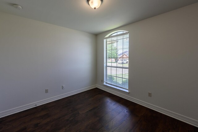 2056 Balsam Gap, Tyler, TX 75703 - empty room featuring baseboards and dark wood-type flooring