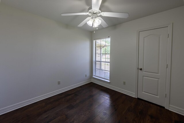 2056 Balsam Gap, Tyler, TX 75703 - spare room featuring baseboards, ceiling fan, and dark wood-style floors