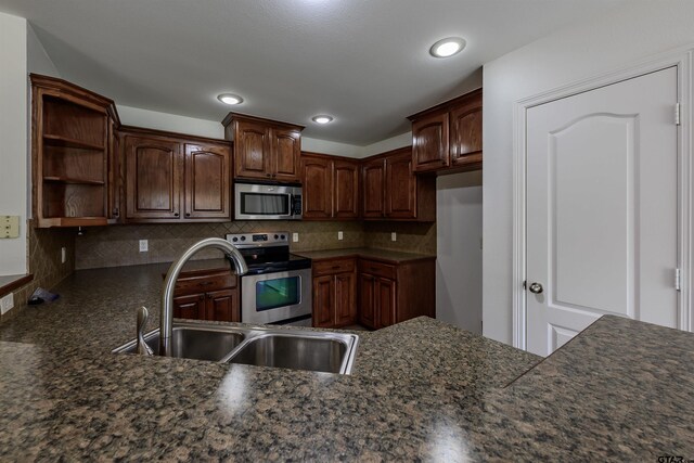 2056 Balsam Gap, Tyler, TX 75703 - kitchen featuring open shelves, stainless steel appliances, a sink, and tasteful backsplash