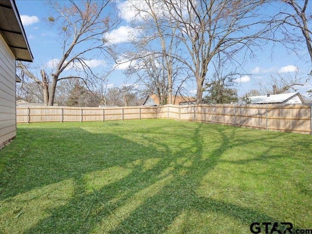 view of yard featuring a fenced backyard